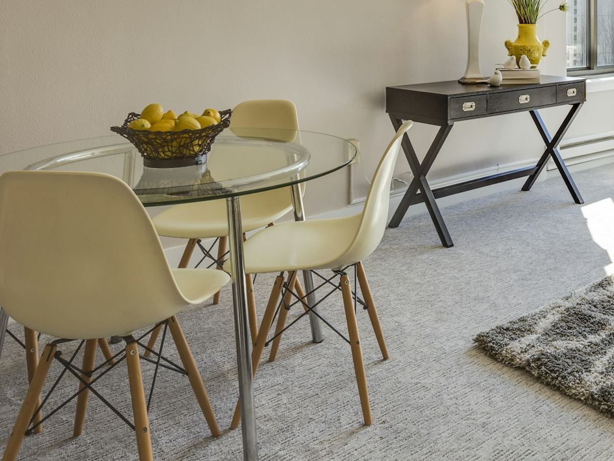 Round glass dining table with chairs